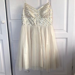 Lovely cream short flirty dress with sequins on the bodice